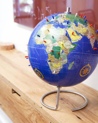 Magnetic desktop world globe with blue oceans, circular metal base