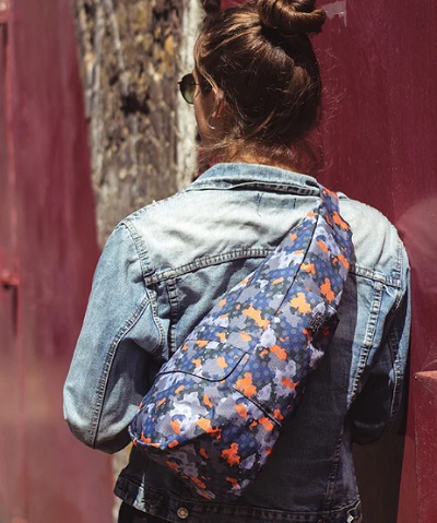 ameribag healthy back bag fusion camo print worn by woman