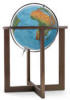 Large lighted blue globe on modern floor stand